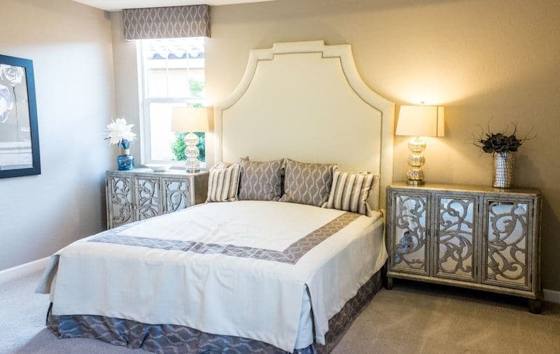 Peaceful bedroom with low-profile walnut bed frame
